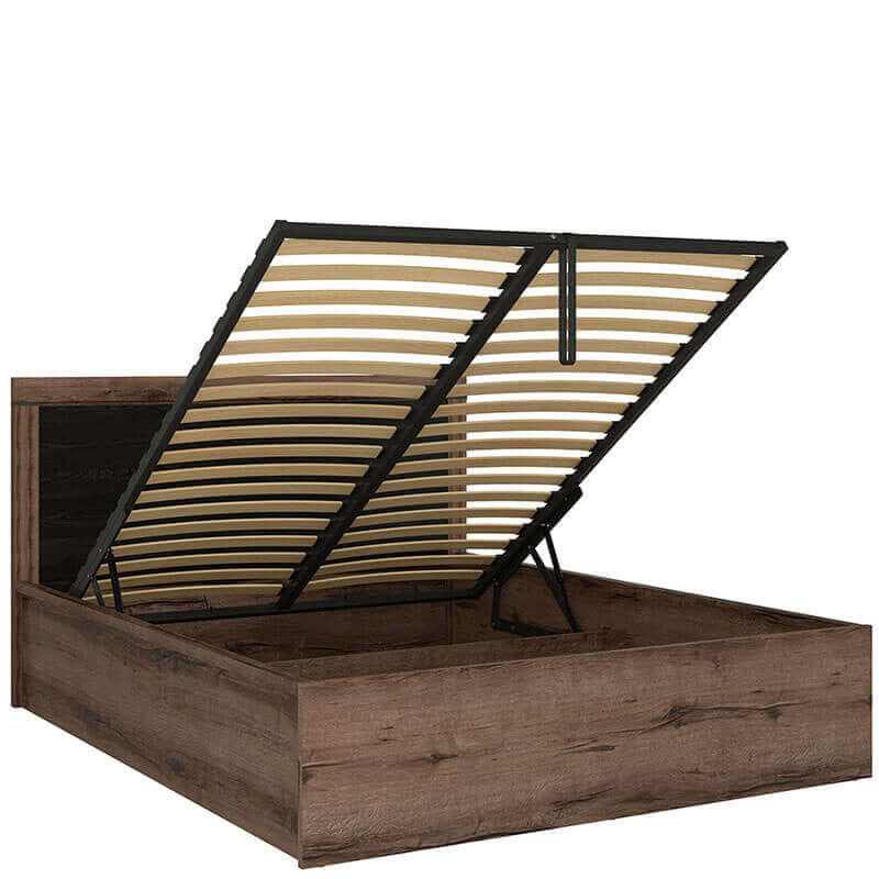 King size bed with gas lift storage in monastery oak finish and high headboard